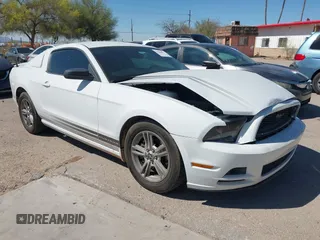 2014 Ford Mustang V6 with VIN 1ZVBP8AM0E5268865, listed as a IAAI auction lot 41884812 with 128,977 mi miles. Bid and sale history available at carsss.com. Image 1.