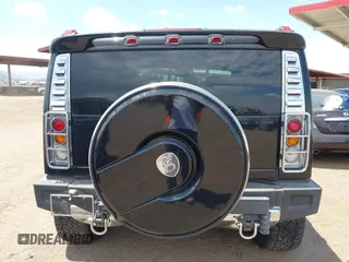 2003 Hummer H2 with VIN 5GRGN23U73H122756, listed as a IAAI auction lot 42194176 with 239,411 mi miles. Bid and sale history available at carsss.com. Image 16.