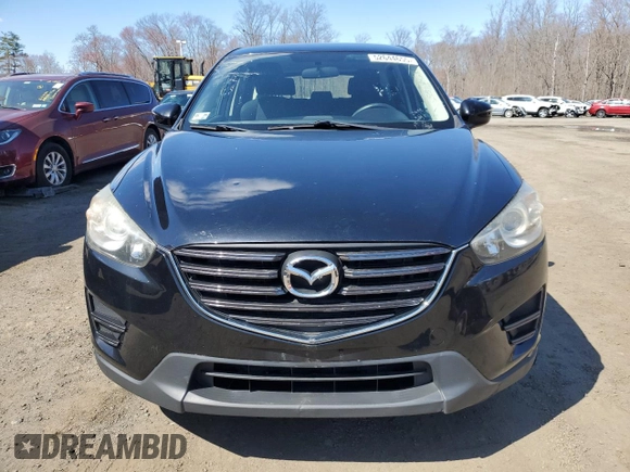 2016 Mazda CX-5 Sport with VIN JM3KE4BY8G0749246, listed as a Copart auction lot 52644655 with 117,753 mi miles and Clean Title. Bid and sale history available at carsss.com. Image 5.