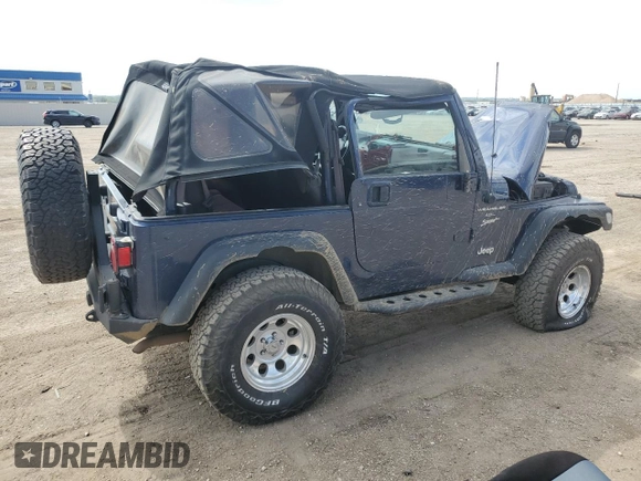 2002 Jeep Wrangler Sport z VIN 1J4FA49SX2P772609, wystawiony jako Copart lot #55893425 z przebiegiem 157 653 mil mil oraz Szkoda całkowita • Salvage title. Historia ofert i sprzedaży dostępna na DreamBid. Obrazek 3.