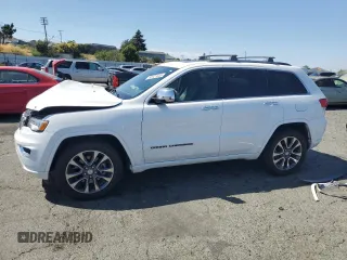2017 Jeep Grand Cherokee Overland z VIN 1C4RJFCT5HC777748, wystawiony jako Copart lot #63121635 z przebiegiem 106 991 mil mil oraz Szkoda całkowita • Salvage title. Historia ofert i sprzedaży dostępna na DreamBid. Obrazek 1.