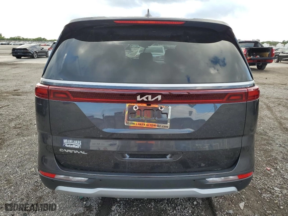 2023 Kia Carnival LX with VIN KNDNB4H38P6255833, listed as a Copart auction lot 86990124 with 6,818 mi miles and Salvage Title. Bid and sale history available at carsss.com. Image 6.