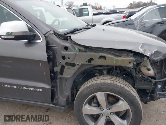 2014 Jeep Grand Cherokee Overland with VIN 1C4RJECG5EC207211, listed as a IAAI auction lot 41586309 with 115,293 mi miles. Bid and sale history available at carsss.com. Image 6.