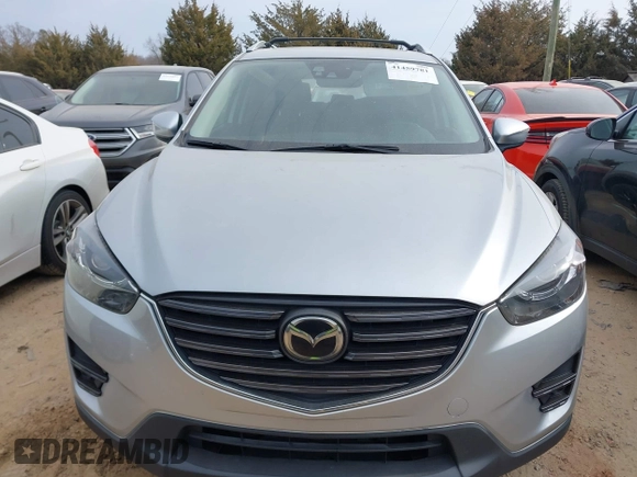 2016 Mazda CX-5 Grand Touring with VIN JM3KE4DY1G0616714, listed as a IAAI auction lot 41459781 with 90,763 mi miles. Bid and sale history available at carsss.com. Image 12.