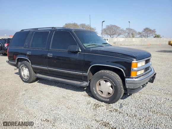 1999 Chevrolet Tahoe Z71 with VIN 1GNEK13R5XJ308924, listed as a Copart auction lot 64463984 with 229,181 mi miles and Salvage Title. Bid and sale history available at carsss.com. Image 4.