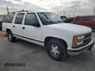 1996 Chevrolet Suburban with VIN 3GNEC16R5TG149147, listed as a Copart auction lot 84827204 with 320,305 mi miles and Salvage title. Bid and sale history available at DreamBid. Image 4.