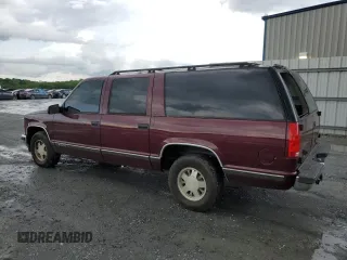 1999 Chevrolet Suburban with VIN 3GNEC16RXXG260623, listed as a Copart auction lot 54609694 with 246,460 mi miles and Salvage Title. Bid and sale history available at carsss.com. Image 2.