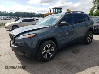 2015 Jeep Cherokee Trailhawk z VIN 1C4PJMBS0FW635064, wystawiony jako Copart lot #57572195 z przebiegiem 129 747 mil mil oraz Szkoda całkowita • Salvage title. Historia ofert i sprzedaży dostępna na DreamBid. Obrazek 1.