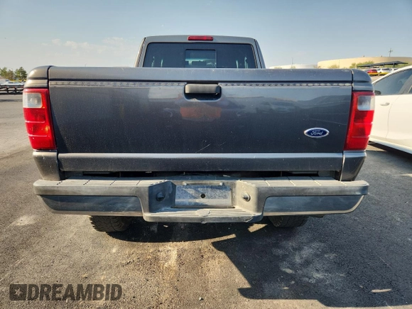 2005 Ford Ranger XLT z VIN 1FTZR45E05PA33894, wystawiony jako Copart lot #65205595 z przebiegiem 154 807 mil mil oraz Czysty tytuł • Clean title. Historia ofert i sprzedaży dostępna na DreamBid. Obrazek 6.