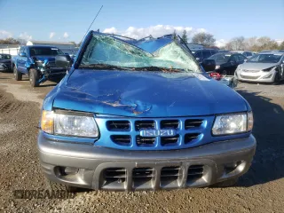 2001 Isuzu Rodeo S with VIN 4S2DM58WX14301336, listed as a Copart auction lot 77770164 with Not provided miles and Salvage title. Bid and sale history available at DreamBid. Image 5.