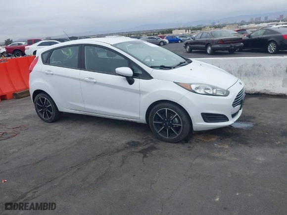 2019 Ford Fiesta SE with VIN 3FADP4EJ7KM121779, listed as a IAAI auction lot 41734728 with 90,590 mi miles. Bid and sale history available at carsss.com. Image 1.
