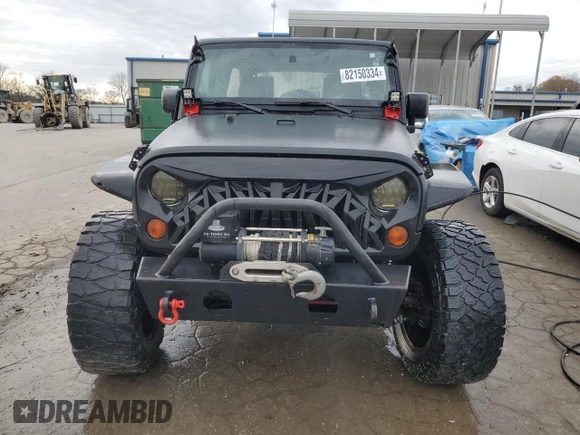 2007 Jeep Wrangler Unlimited X with VIN 1J4GA391X7L171902, listed as a Copart auction lot 82150334 with 167,695 mi miles and Salvage title. Bid and sale history available at DreamBid. Image 5.