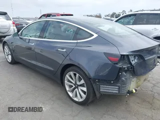 2018 Tesla Model 3 Long Range Battery with VIN 5YJ3E1EA8JF059385, listed as a IAAI auction lot 42116589 with 63,630 mi miles and . Bid and sale history available at DreamBid. Image 3.