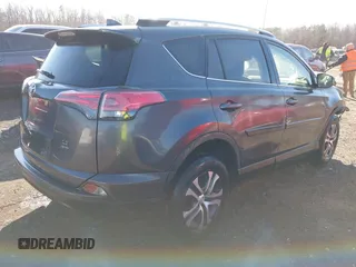 2016 Toyota RAV4 LE with VIN JTMBFREV9GJ071041, listed as a IAAI auction lot 41410462 with 57,396 mi miles. Bid and sale history available at carsss.com. Image 4.