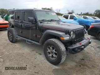 2019 Jeep Wrangler Unlimited Rubicon with VIN 1C4HJXFN6KW665805, listed as a Copart auction lot 45424005 with 141,007 mi miles and Salvage title. Bid and sale history available at DreamBid. Image 4.