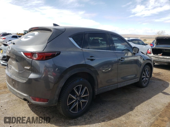 2018 Mazda CX-5 Grand Touring z VIN JM3KFBDM4J0300519, wystawiony jako Copart lot #51548745 z przebiegiem 102 853 mil mil oraz Szkoda całkowita • Salvage title. Historia ofert i sprzedaży dostępna na DreamBid. Obrazek 3.