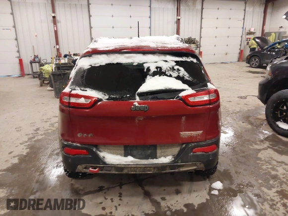 2015 Jeep Cherokee Trailhawk with VIN 1C4PJMBS2FW609999, listed as a IAAI auction lot 41582536 with 133,666 mi miles. Bid and sale history available at carsss.com. Image 16.