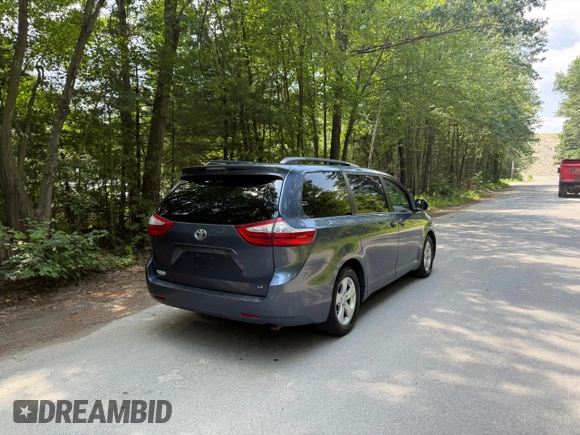 2015 Toyota Sienna LE AAS with VIN 5TDKK3DC1FS623710, listed as a Copart auction lot 62335575 with 221,148 mi miles and Clean title. Bid and sale history available at DreamBid. Image 4.