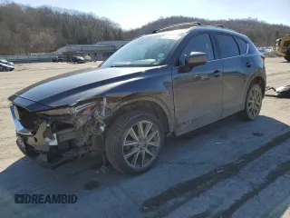 2018 Mazda CX-5 Grand Touring with VIN JM3KFBDM2J0407164, listed as a Copart auction lot 50080345 with 126,464 mi miles and Salvage title. Bid and sale history available at DreamBid. Image 1.