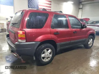 2004 Ford Escape XLS with VIN 1FMYU021X4DA05312, listed as a Copart auction lot 86185954 with 186,010 mi miles and Salvage Title. Bid and sale history available at DreamBid. Image 3.