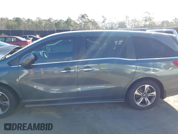 2020 Honda Odyssey Touring z VIN 5FNRL6H8XLB035047, wystawiony jako IAAI lot #41794343 z przebiegiem 57 537 mil mil oraz . Historia ofert i sprzedaży dostępna na DreamBid. Obrazek 14.