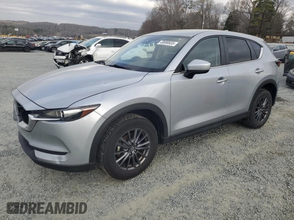 2021 Mazda CX-5 Touring with VIN JM3KFACM2M0451083, listed as a Copart auction lot 49999935 with 59,927 mi miles and Salvage Title. Bid and sale history available at carsss.com. Image 1.