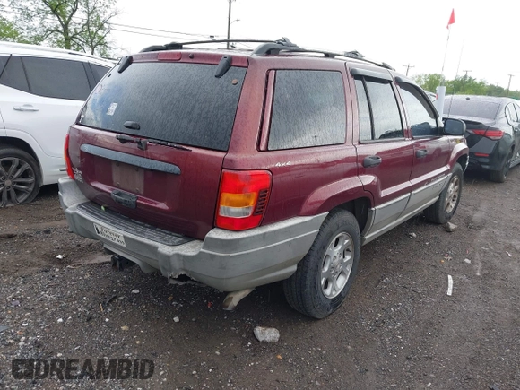 2000 Jeep Grand Cherokee Laredo z VIN 1J4GW48S5YC234942, wystawiony jako IAAI lot #42092378 z przebiegiem 235 168 mil mil oraz . Historia ofert i sprzedaży dostępna na DreamBid. Obrazek 4.