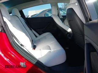 2021 Tesla Model 3 Long Range with VIN 5YJ3E1EBXMF990242, listed as a IAAI auction lot 41674222 with 24,554 mi miles and . Bid and sale history available at DreamBid. Image 8.