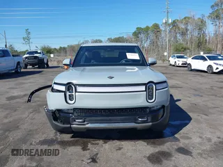 2024 Rivian R1T Adventure z VIN 7FCTGAAA5RN033799, wystawiony jako IAAI lot #41606562 z przebiegiem 9 449 mil mil oraz . Historia ofert i sprzedaży dostępna na DreamBid. Obrazek 12.