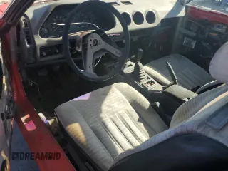 1983 Datsun 280ZX z VIN JN1HZ04S4DX568496, wystawiony jako Copart lot #57705145 z przebiegiem 328 479 mil mil oraz Tytuł czysty. Historia ofert i sprzedaży dostępna na DreamBid. Obrazek 8.