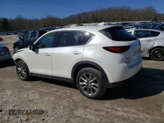 2021 Mazda CX-5 Grand Touring with VIN JM3KFBDM9M1426809, listed as a Copart auction lot 48468345 with 74,500 mi miles and Salvage Title. Bid and sale history available at carsss.com. Image 2.