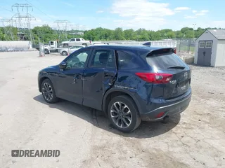 2016 Mazda CX-5 Grand Touring z VIN JM3KE4DY1G0817562, wystawiony jako IAAI lot #42289929 z przebiegiem 135 476 mil mil oraz . Historia ofert i sprzedaży dostępna na DreamBid. Obrazek 3.
