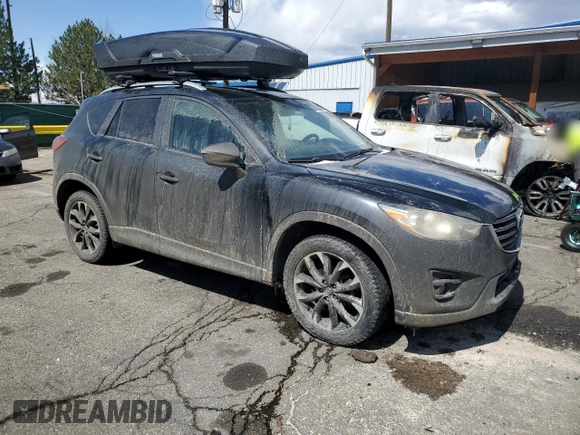 2016 Mazda CX-5 Grand Touring with VIN JM3KE4DYXG0730145, listed as a Copart auction lot 51666535 with 117,677 mi miles and Salvage Title. Bid and sale history available at carsss.com. Image 4.