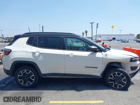 2020 Jeep Compass Trailhawk z VIN 3C4NJDDB5LT248662, wystawiony jako IAAI lot #42574553 z przebiegiem 28 118 mil mil oraz . Historia ofert i sprzedaży dostępna na DreamBid. Obrazek 13.