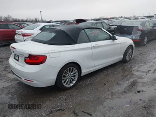 2016 BMW 2 Series 228i xDrive with VIN WBA1L9C59GV767802, listed as a IAAI auction lot 41132997 with 87,674 mi miles. Bid and sale history available at carsss.com. Image 4.