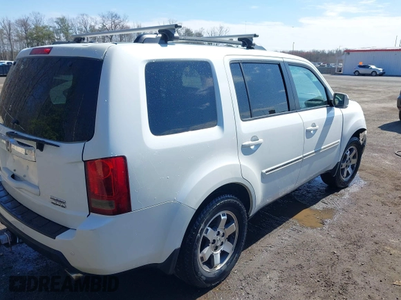 2011 Honda Pilot Touring with VIN 5FNYF4H96BB014095, listed as a IAAI auction lot 41794052 with 202,440 mi miles and . Bid and sale history available at DreamBid. Image 4.