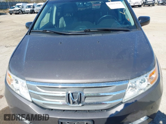 2012 Honda Odyssey Touring with VIN 5FNRL5H9XCB077351, listed as a IAAI auction lot 42045976 with 146,290 mi miles and . Bid and sale history available at DreamBid. Image 6.