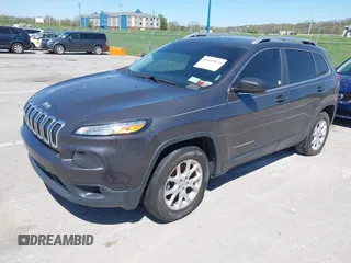 2014 Jeep Cherokee Latitude with VIN 1C4PJMCS2EW137767, listed as a IAAI auction lot 42052071 with 165,300 mi miles and . Bid and sale history available at DreamBid. Image 2.