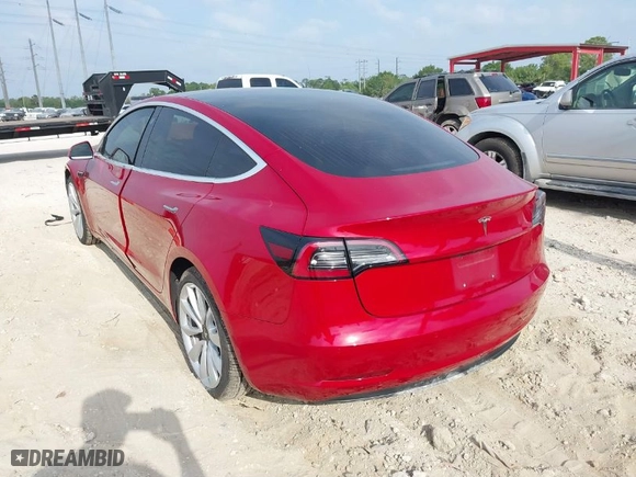 2018 Tesla Model 3 Long Range Battery with VIN 5YJ3E1EA4JF053227, listed as a IAAI auction lot 41854908 with 84,293 mi miles. Bid and sale history available at carsss.com. Image 3.