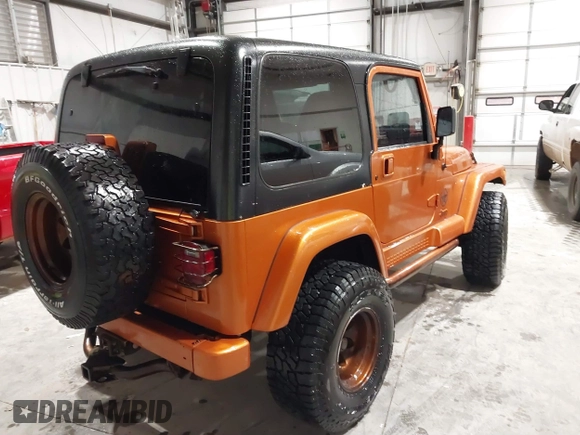 1998 Jeep Wrangler Sahara z VIN 1J4FY49S1WP802940, wystawiony jako IAAI lot #41433820 z przebiegiem 122 180 mil mil oraz . Historia ofert i sprzedaży dostępna na DreamBid. Obrazek 4.