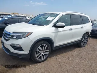 2017 Honda Pilot Touring with VIN 5FNYF5H95HB042632, listed as a IAAI auction lot 42011885 with 103,321 mi miles. Bid and sale history available at carsss.com. Image 18.