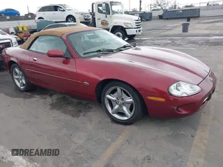 1997 Jaguar XK with VIN SAJGX2745VC017589, listed as a IAAI auction lot 42208129 with Not Provided miles and . Bid and sale history available at DreamBid. Image 1.