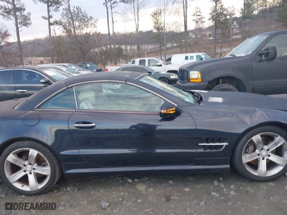2009 Mercedes-Benz SL-Class V8 with VIN WDBSK71F29F143653, listed as a IAAI auction lot 41310556 with 115,377 mi miles. Bid and sale history available at carsss.com. Image 13.