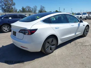 2019 Tesla Model 3 Mid Range with VIN 5YJ3E1EA1KF422983, listed as a IAAI auction lot 41861334 with 53,017 mi miles. Bid and sale history available at carsss.com. Image 4.