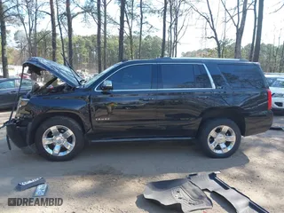 2015 Chevrolet Tahoe LTZ with VIN 1GNSKCKC2FR101306, listed as a IAAI auction lot 41909631 with 218,102 mi miles. Bid and sale history available at carsss.com. Image 14.