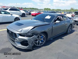 2024 Ford Mustang GT with VIN 1FA6P8CF8R5404304, listed as a IAAI auction lot 42269917 with 32,223 mi miles and . Bid and sale history available at DreamBid. Image 2.