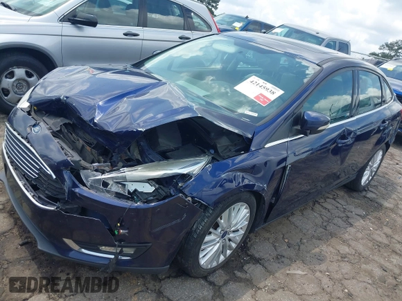 2016 Ford Focus Titanium z VIN 1FADP3J20GL208439, wystawiony jako IAAI lot #42145938 z przebiegiem 135 522 mil mil oraz . Historia ofert i sprzedaży dostępna na DreamBid. Obrazek 18.