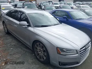 2015 Audi A8 L 4.0T with VIN WAU32AFD7FN021203, listed as a IAAI auction lot 41736045 with 135,471 mi miles. Bid and sale history available at carsss.com. Image 1.