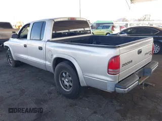 2003 Dodge Dakota SLT with VIN 1D7HL48N13S294573, listed as a IAAI auction lot 41291127 with 227,355 mi miles. Bid and sale history available at carsss.com. Image 3.