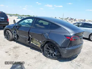 2024 Tesla Model Y with VIN 7SAYGDED3RF019063, listed as a IAAI auction lot 42061888 with 13,763 mi miles and . Bid and sale history available at DreamBid. Image 3.